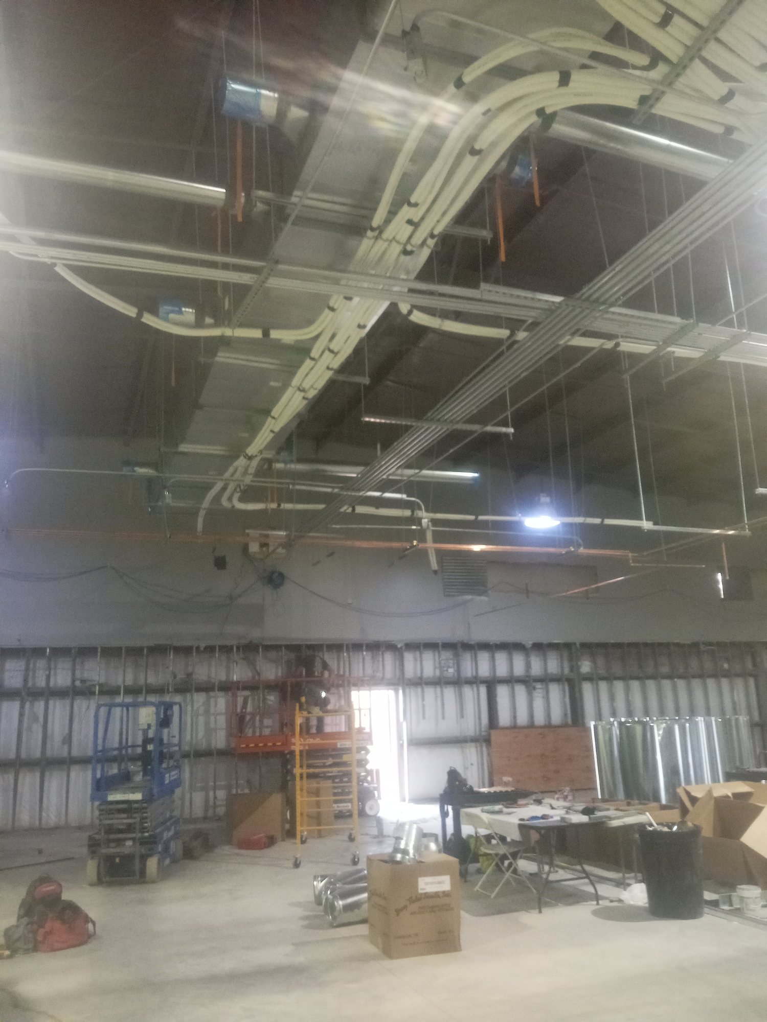 The gutted event center shell, cleared to structure