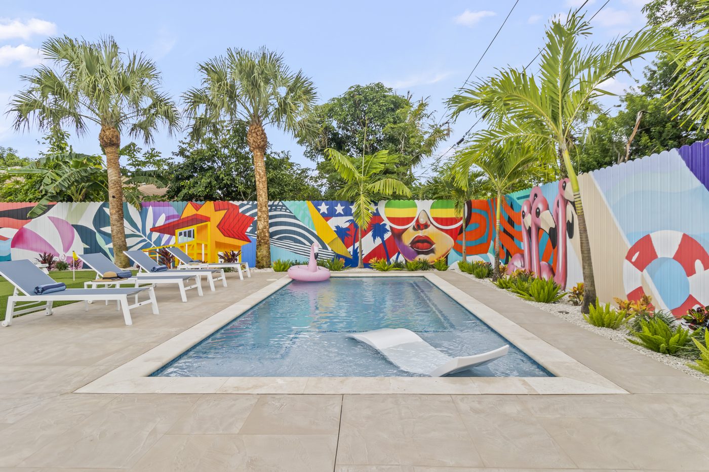Pool, loungers and the full-length mural backdrop