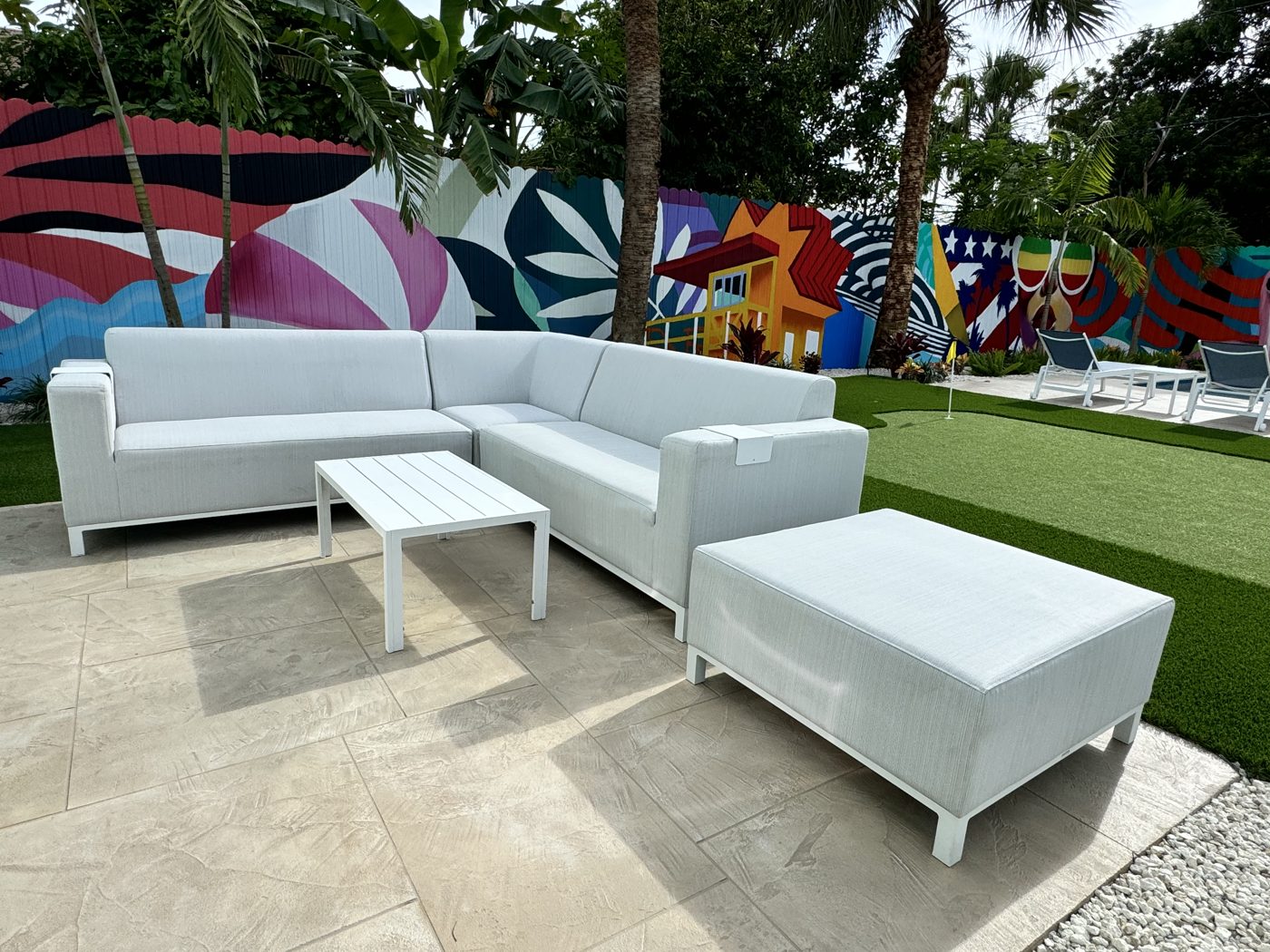 White outdoor sectional on the paver patio