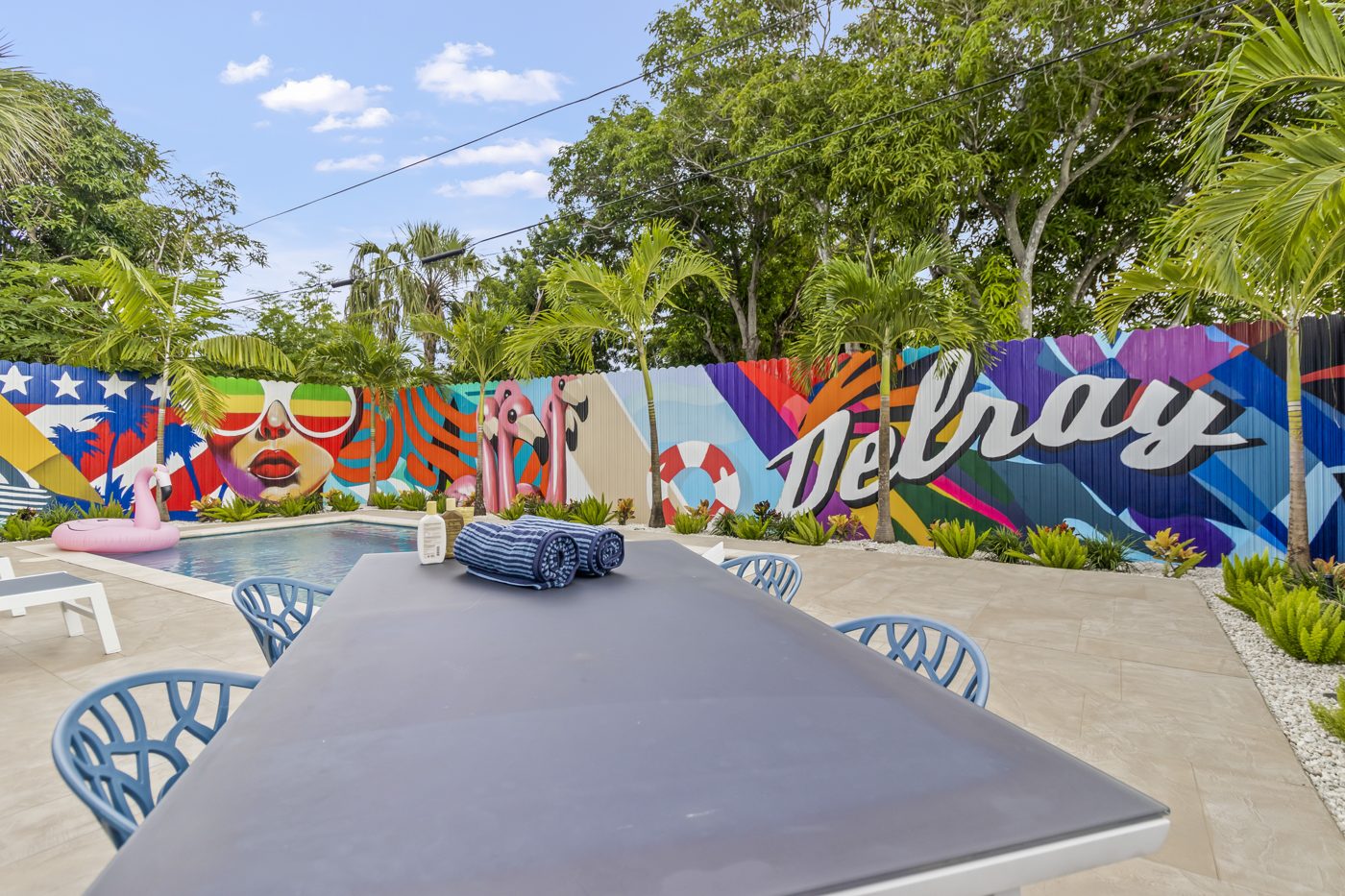 Pool deck with loungers and the full mural wall