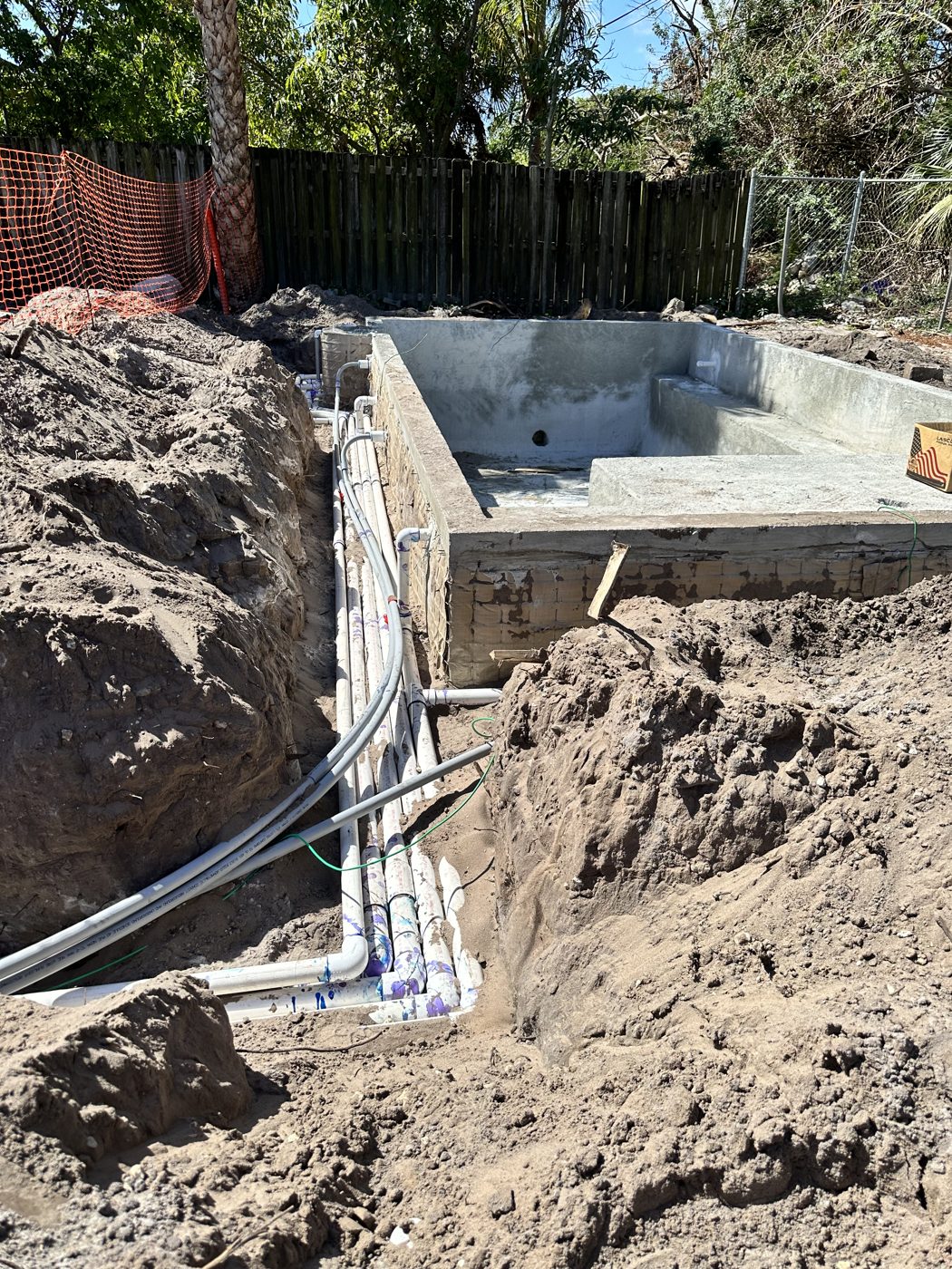 Plumbing trench running to the pool shell
