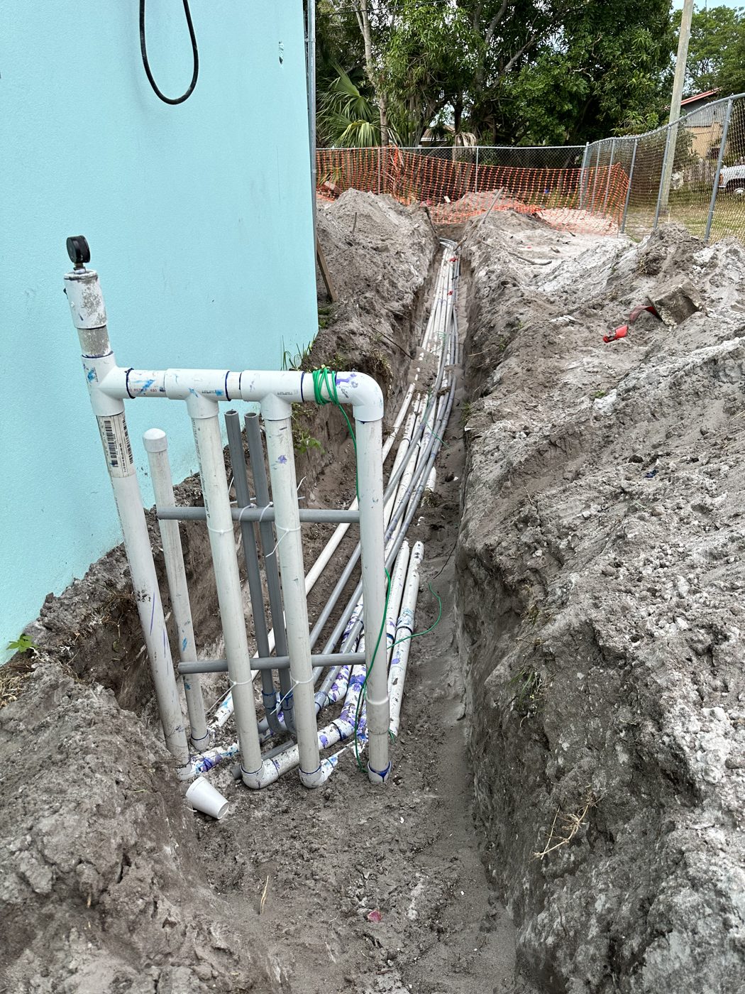 Pool plumbing manifold at the equipment pad