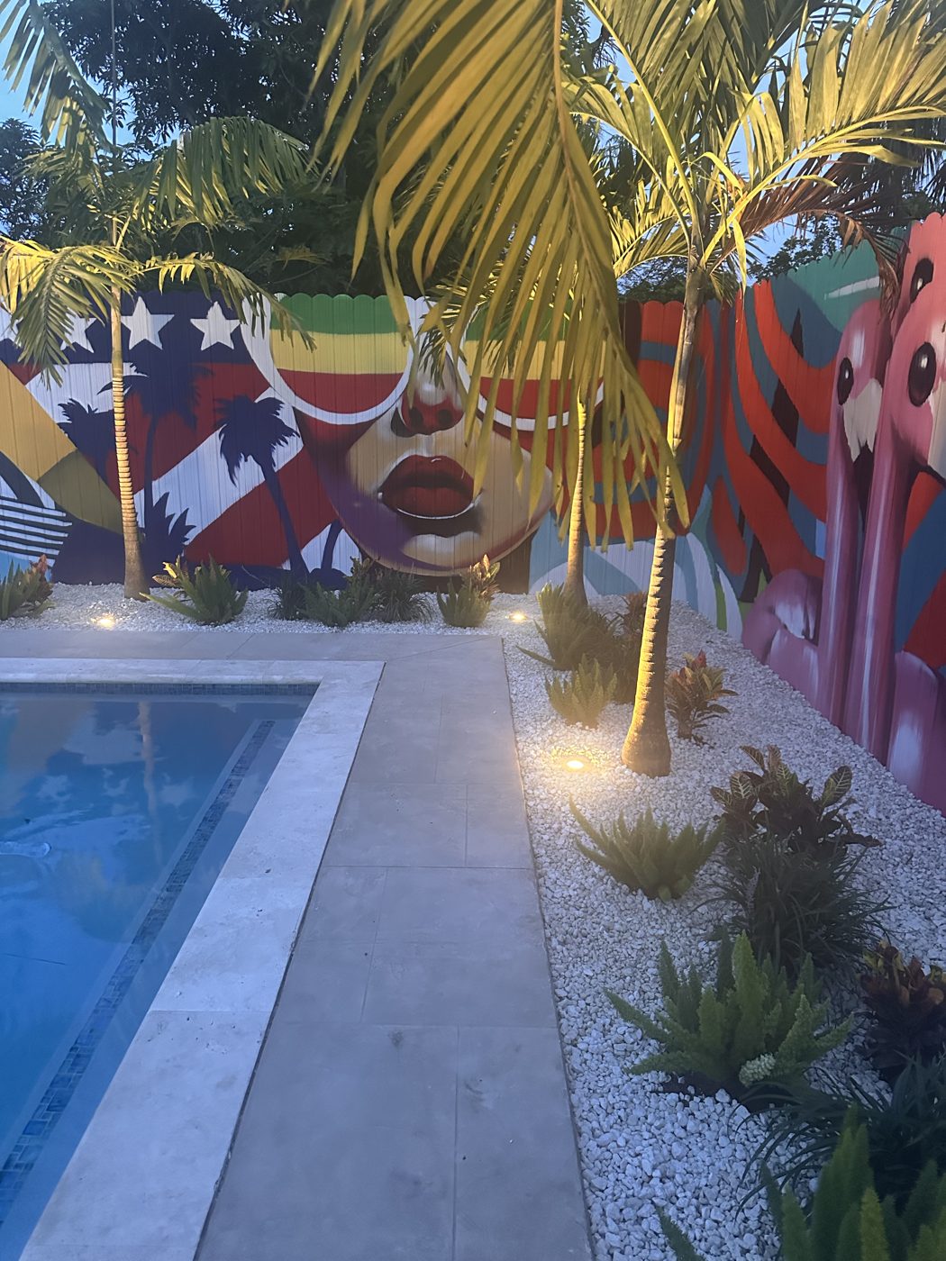 Pool and mural lit at night