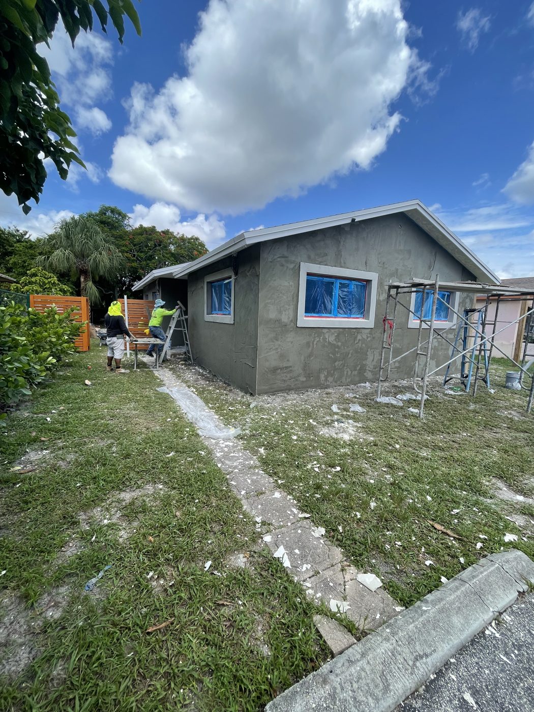 The original house and side yard before demolition