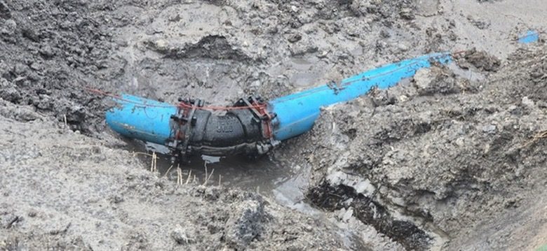 Crew tying a new water main into the existing line at the Mall at Millenia
