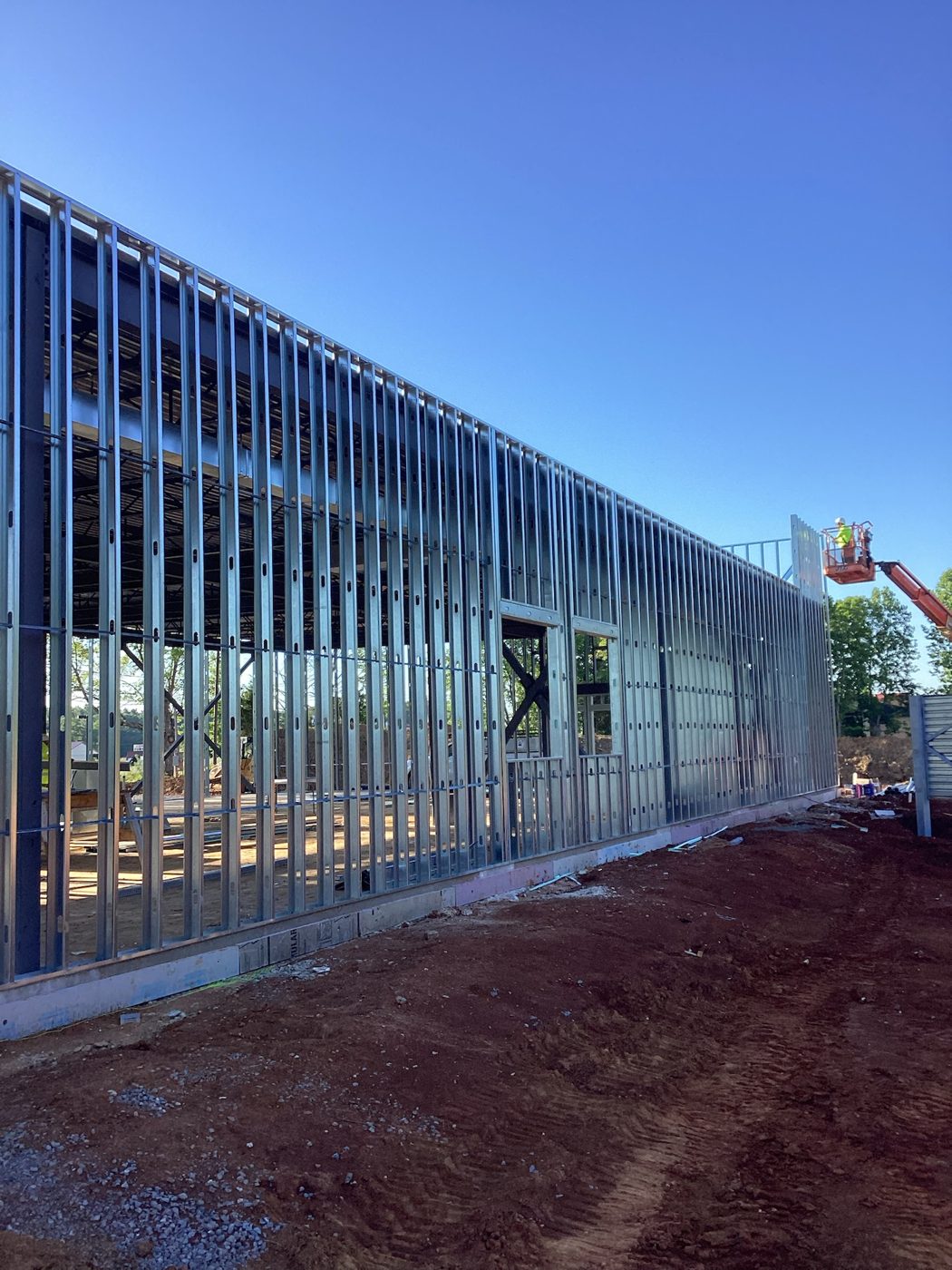 Exterior metal stud walls framed against the sky