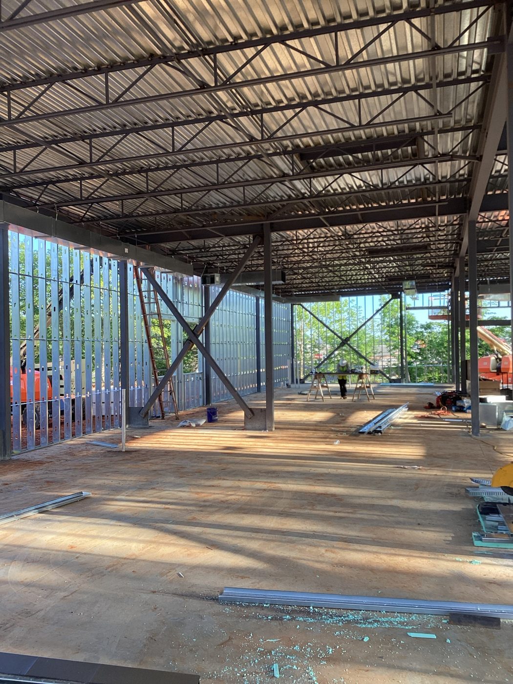 Inside the steel frame as sheathing and weather barrier go on the walls