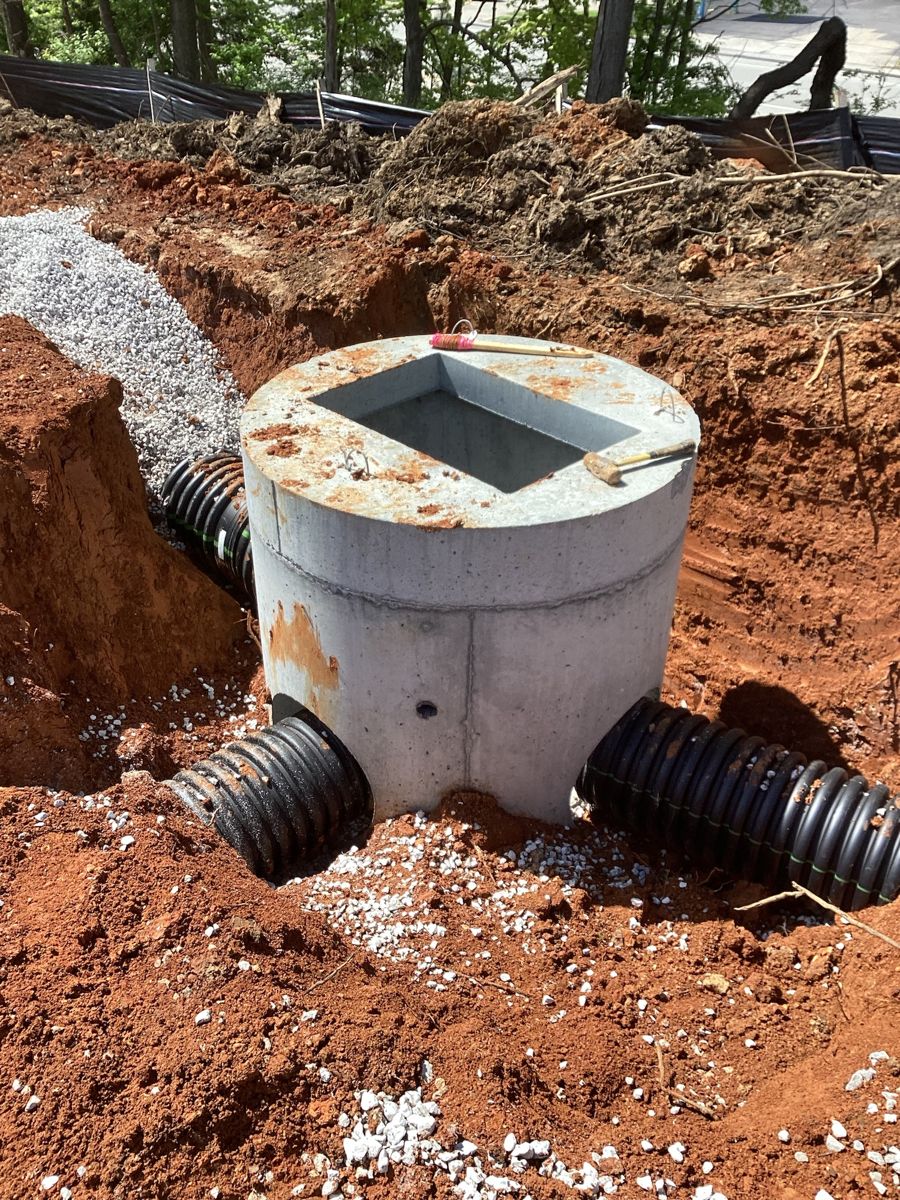 Concrete storm structure with corrugated pipe connections