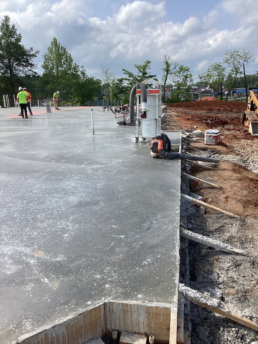 Fresh slab being finished, edge form still in place