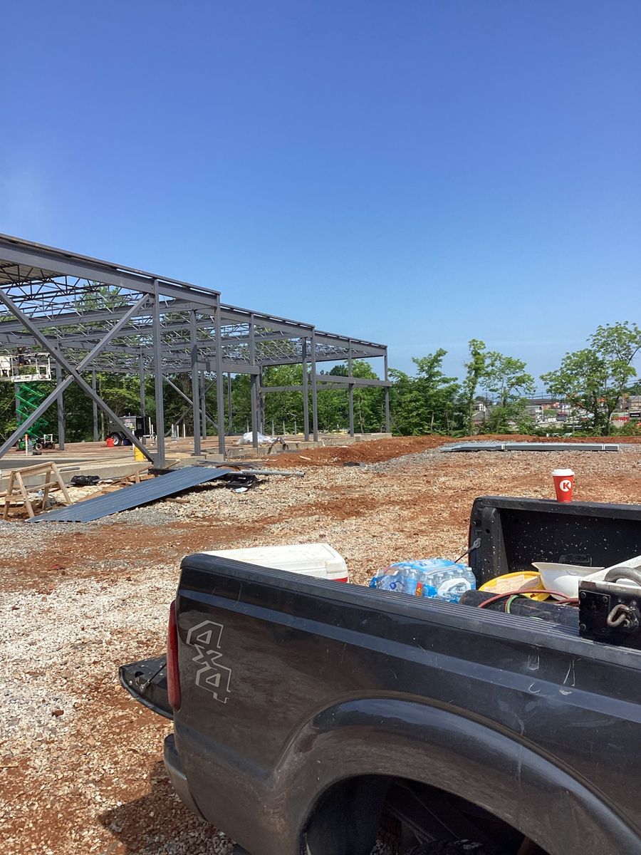 First steel columns and beams seen from the site drive