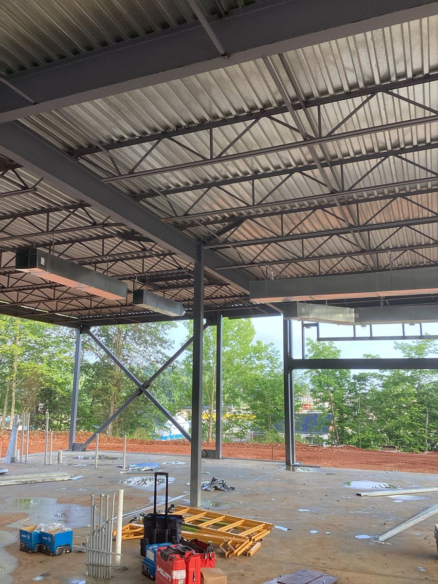 Under the new roof deck inside the steel frame