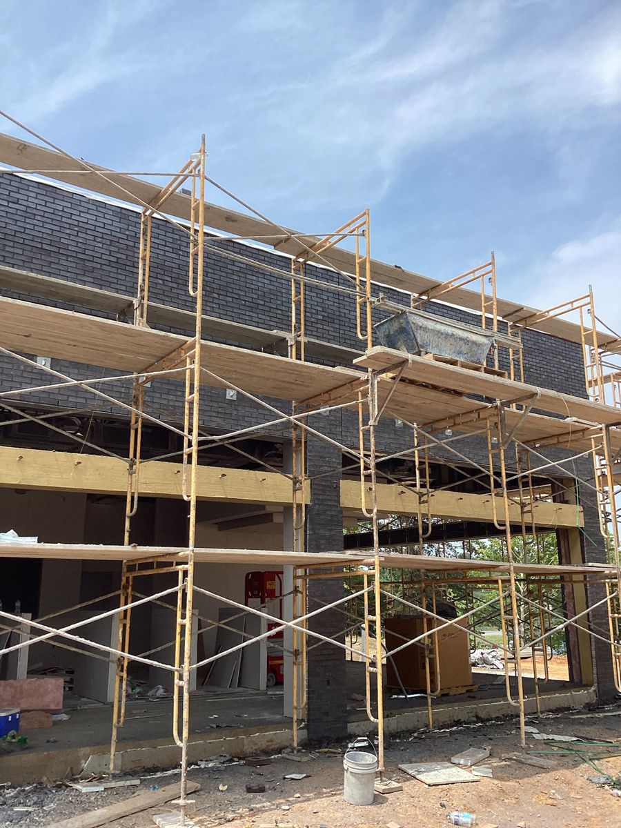 Scaffold on the storefront elevation at the corner