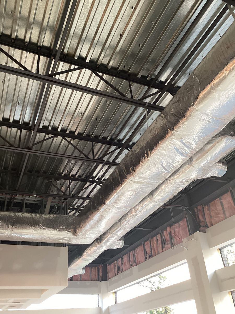 Insulated ductwork run under the roof deck
