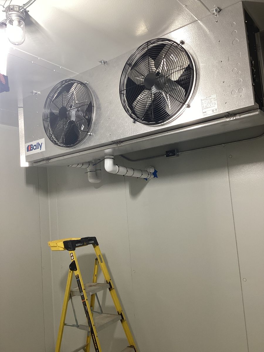 Evaporator fans mounted inside the walk-in cold room