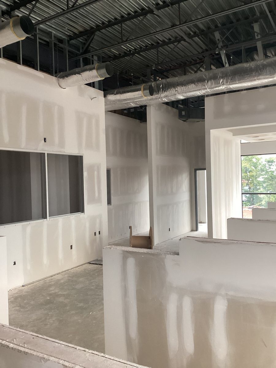 Drywall hung and taped through the interior