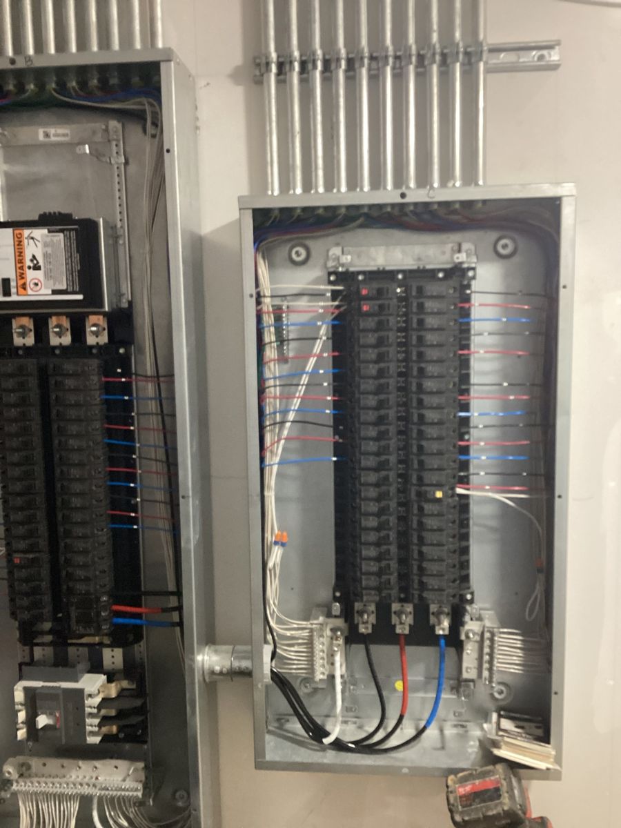 Electrical panel with breakers and wiring landed