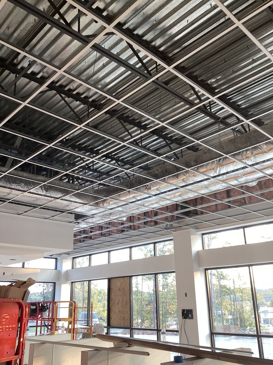 Ceiling grid going in with the roof deck open above