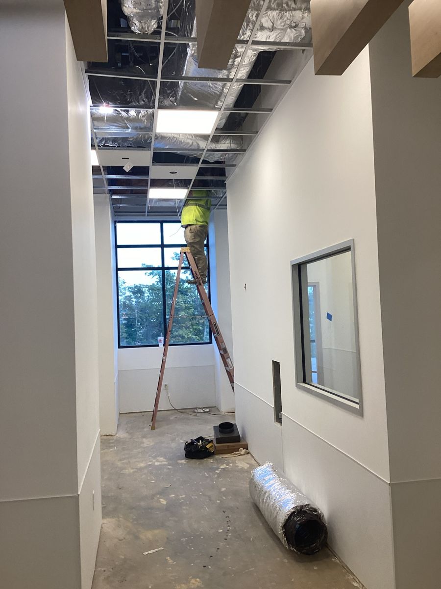 Corridor with door frames set and the ceiling still open