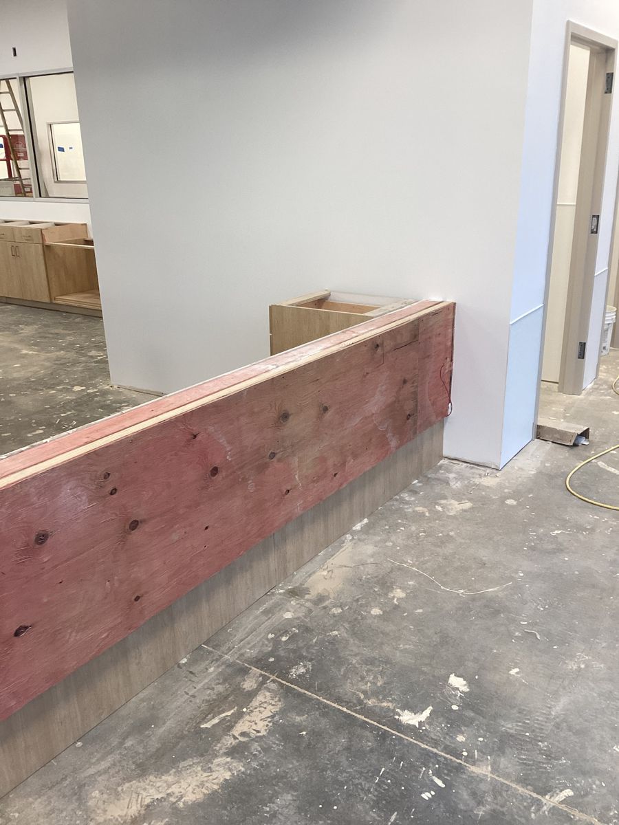 Front desk framing with the plywood counter base