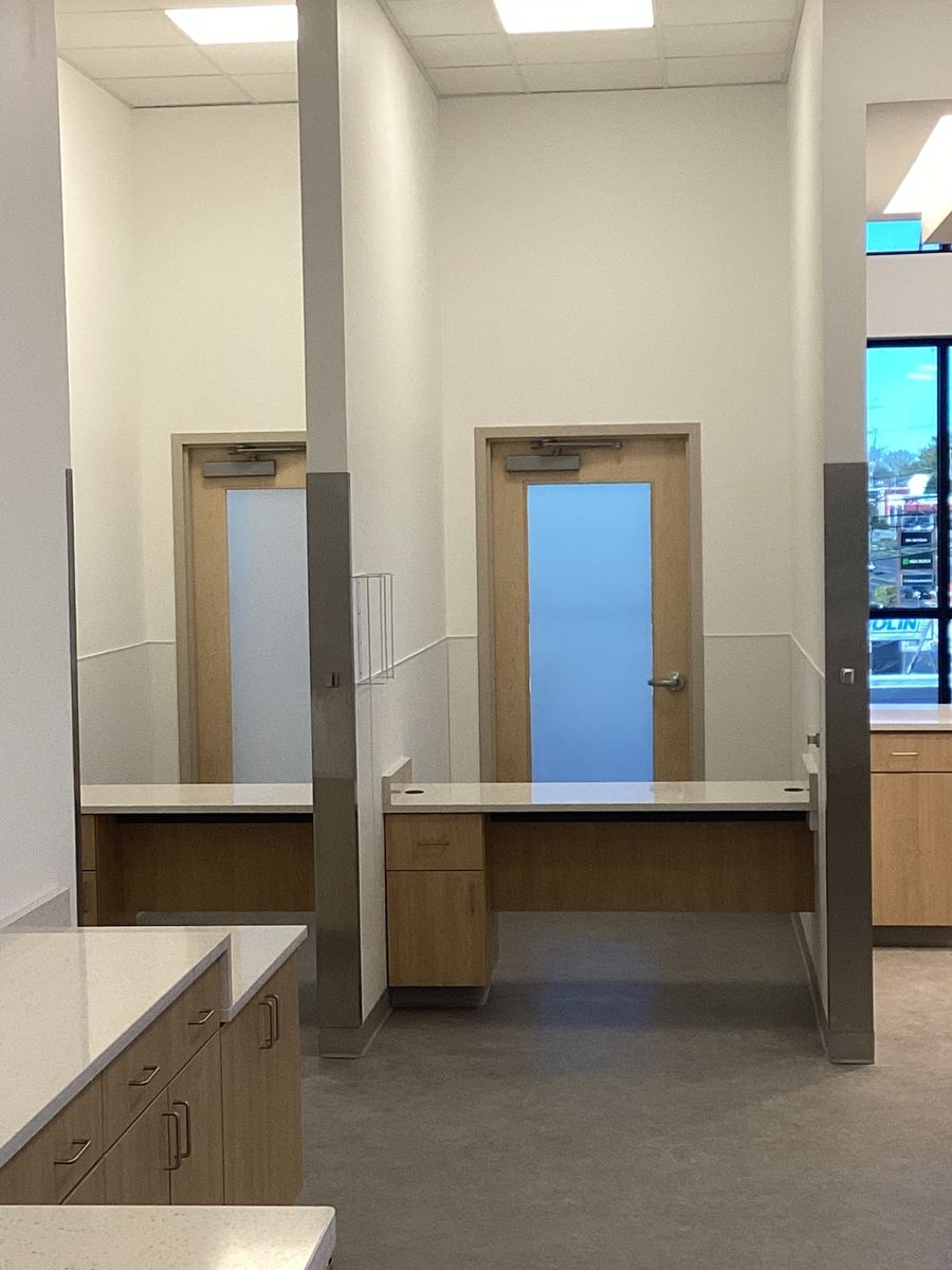 Finished corridor with two doors and casework on both sides