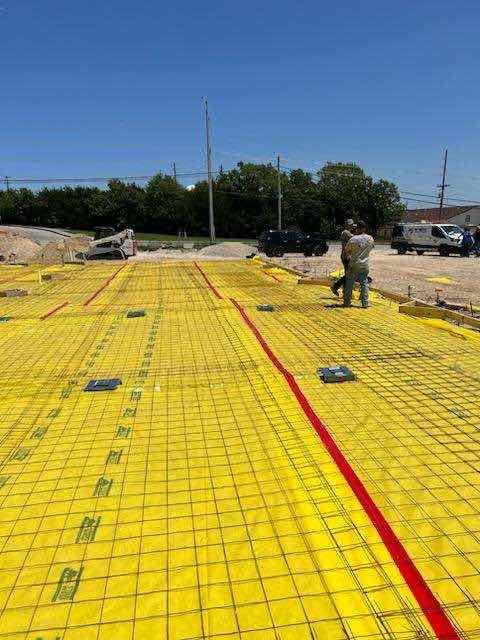 Vapor barrier and rebar mesh laid out ahead of the slab pour