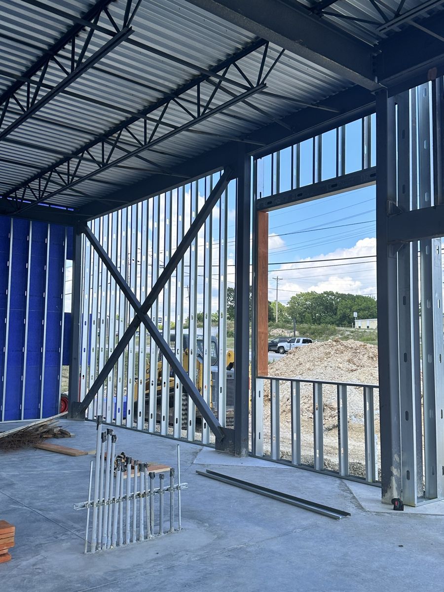 Cross-braced exterior stud wall framed around the entry