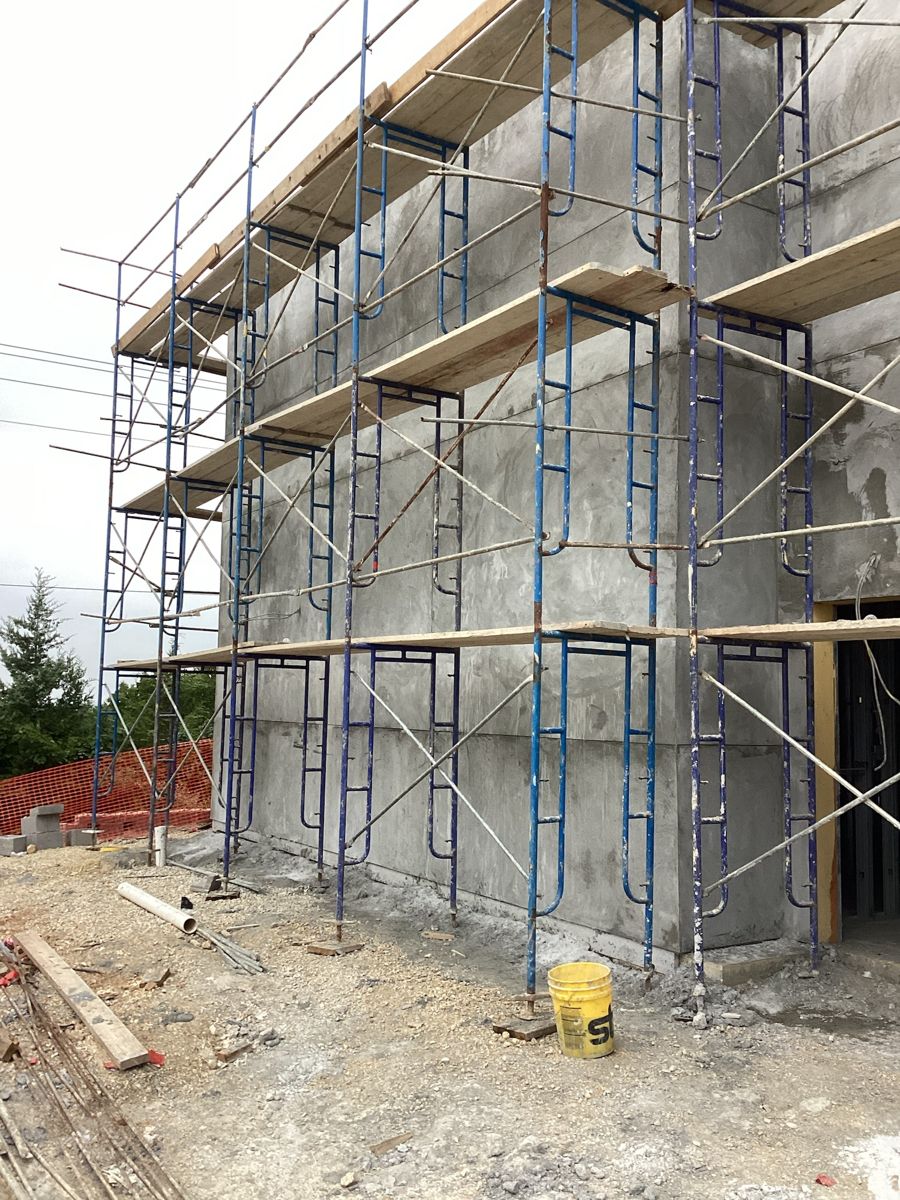 Scaffolding along the exterior wall for the stucco base coat