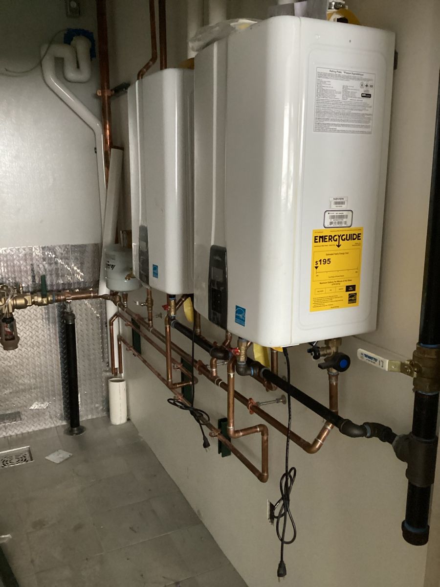 Bank of tankless water heaters with copper supply lines