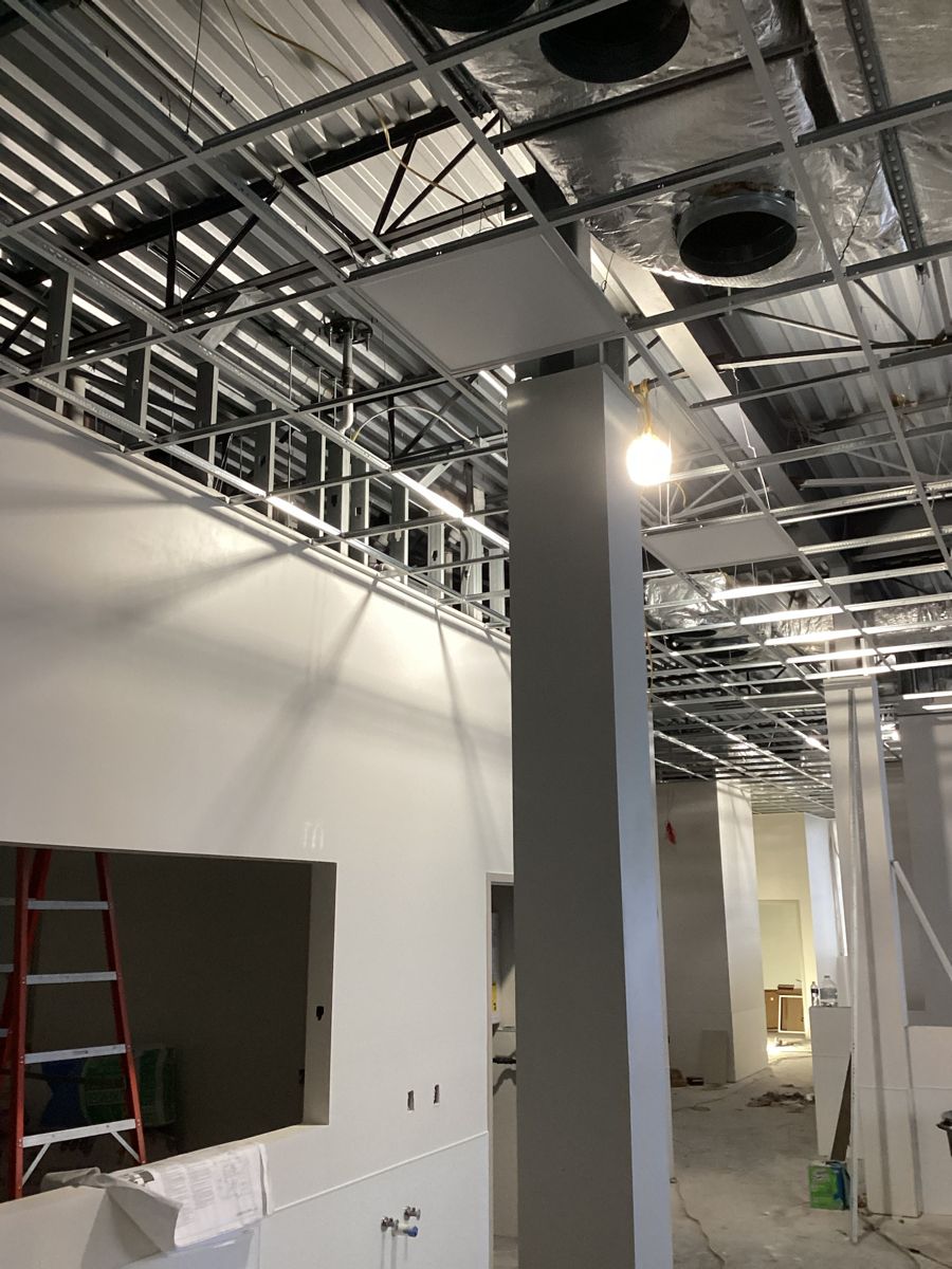 Drywall column and suspended ceiling grid taking shape