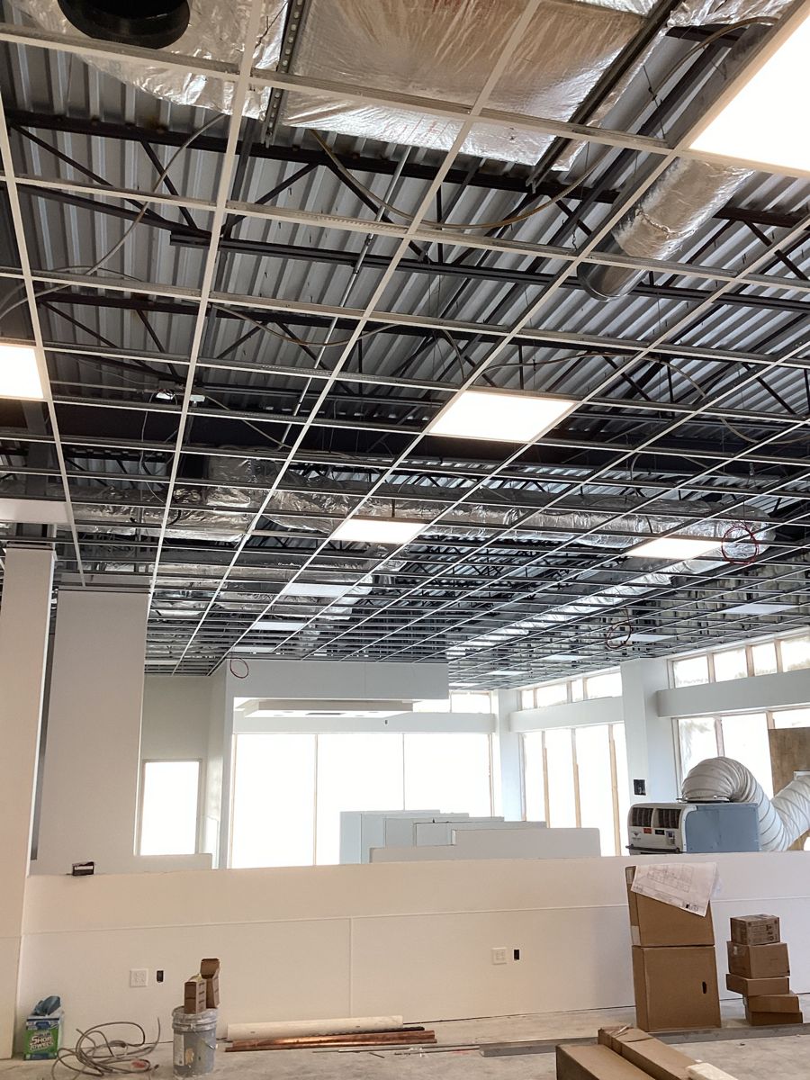 Suspended ceiling grid and light panels over the donor floor