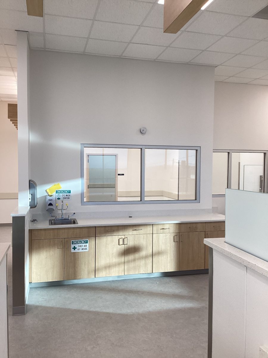 Lab casework with eye wash station and pass-through window