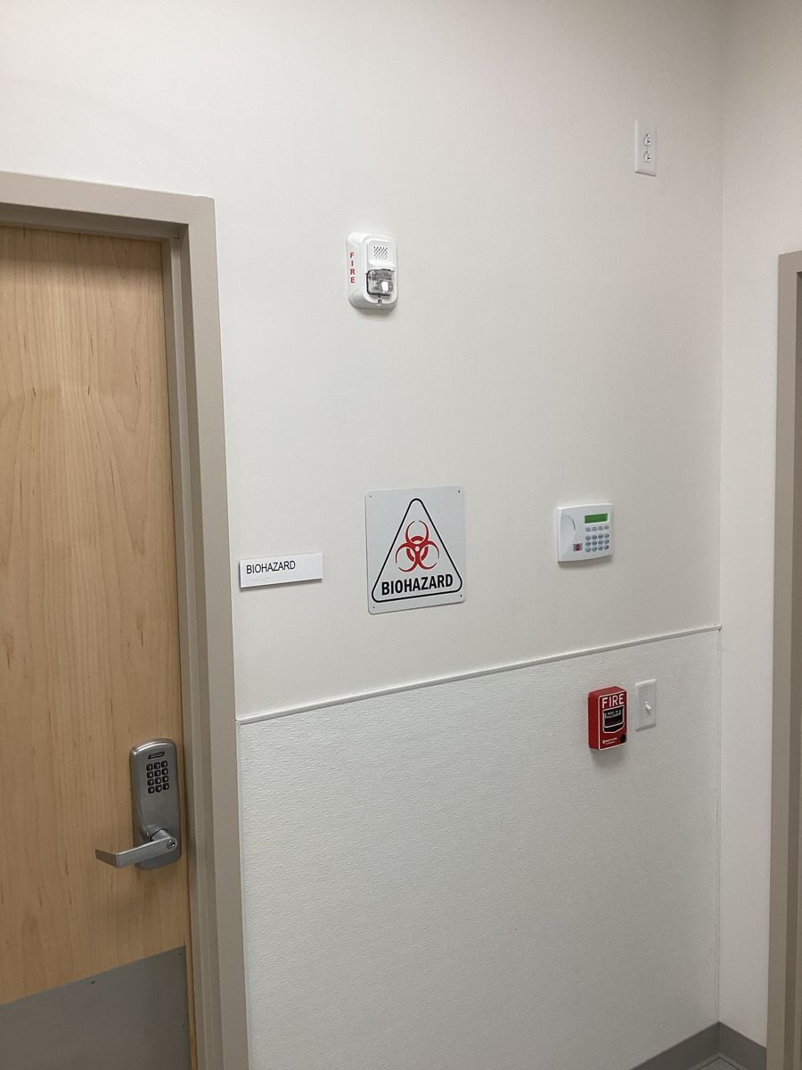 Biohazard door with fire alarm pull and card reader